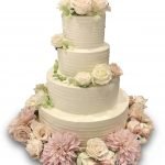 Homespun wedding cake with fresh flowers
