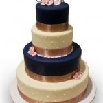 Four tiered navy and ivory fondant covered wedding cake