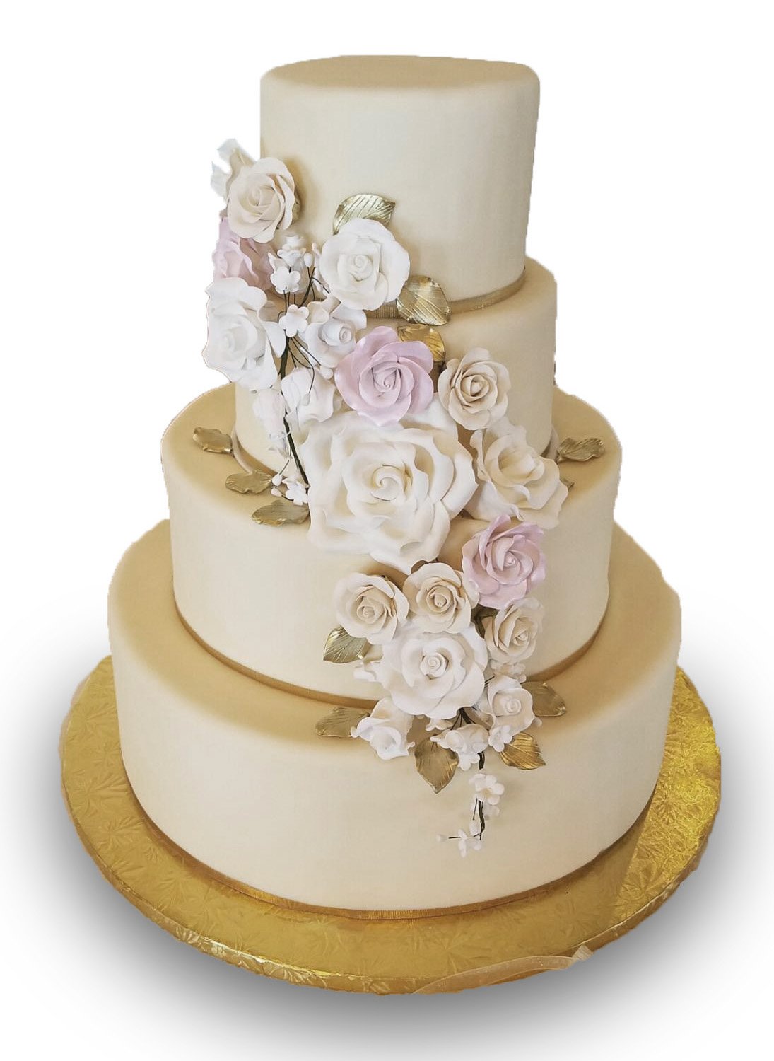Fondant covered four tier wedding cake with gumpaste flowers 