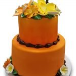 Orange tropical cake with gumpaste bamboo and flowers