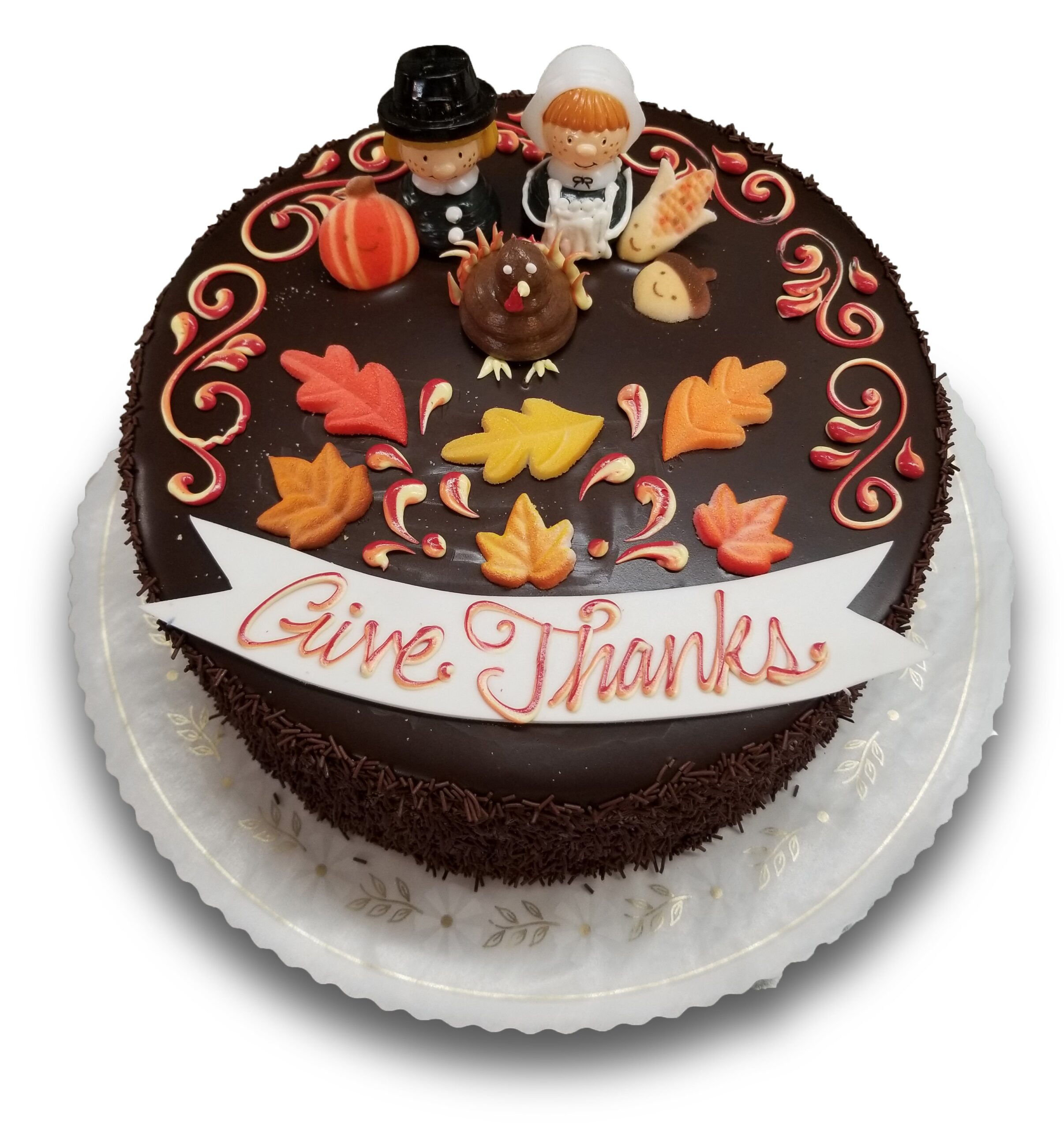 Thanksgiving cake with pilgrims, turkey and sugar leaves