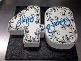 AB029. Fondant covered 40 shaped cake with chocolate scrolls