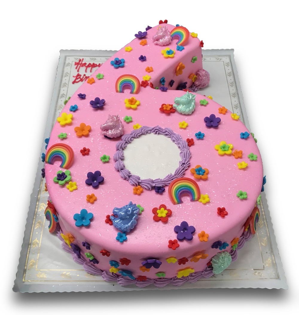 Fondant covered 6 shaped cake decorated with assorted rainbows
