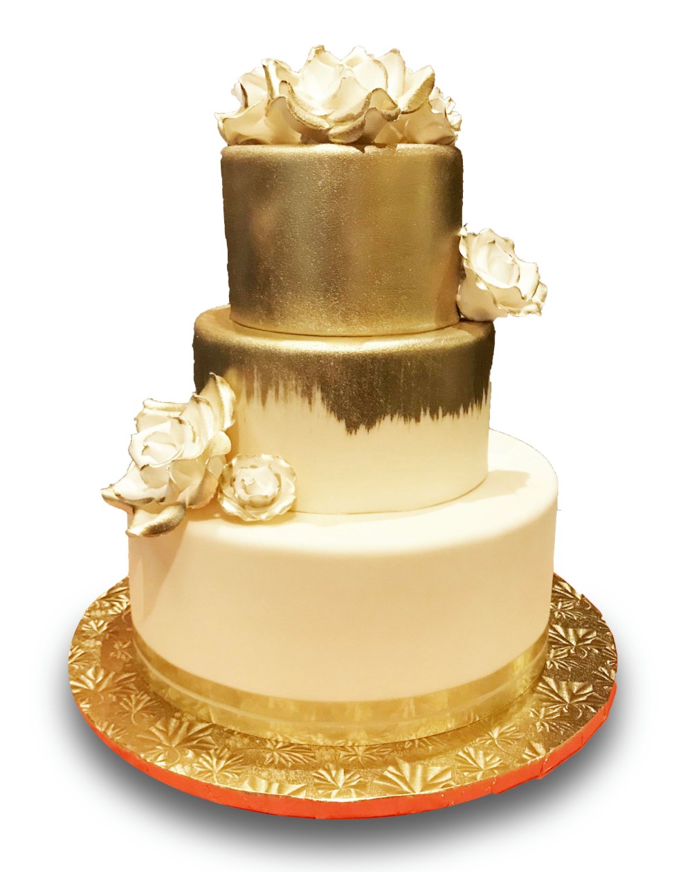 Fondant covered wedding cake brushed gold with gumpaste roses 