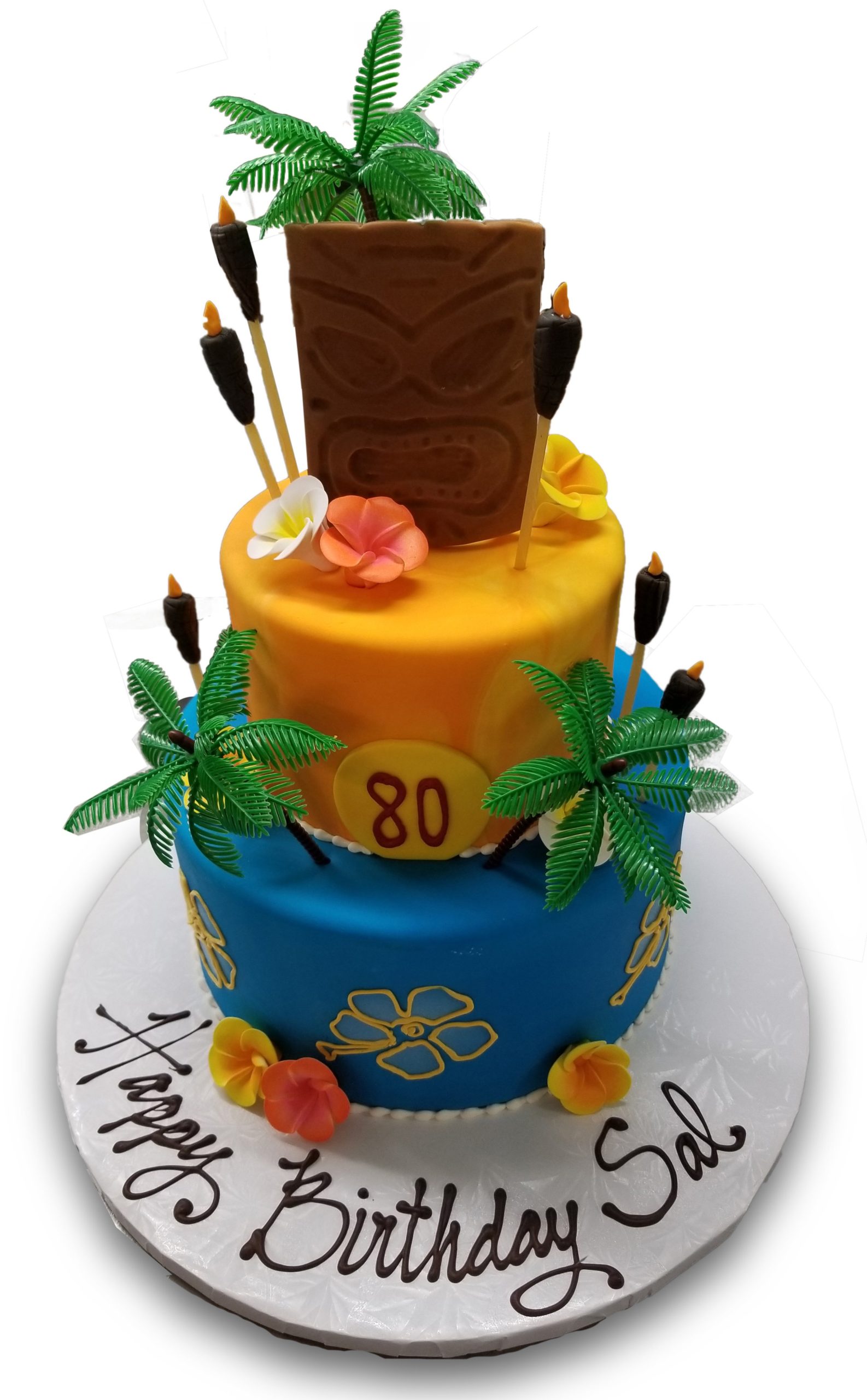 AB017. Two tiered fondant covered tiki tropical birthday cake with gumpaste flowers