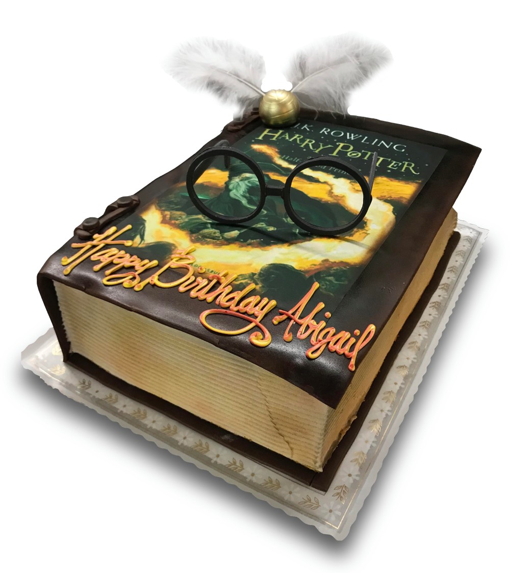 Fondant and scan covered Harry Potter book cake with fondant glasses and snitch