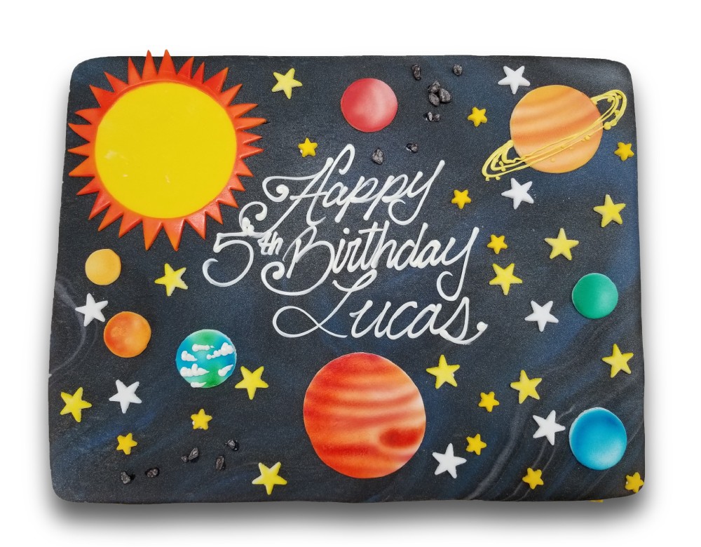 Marbled fondant covered birthday cake with fondant planets and sugar stars 