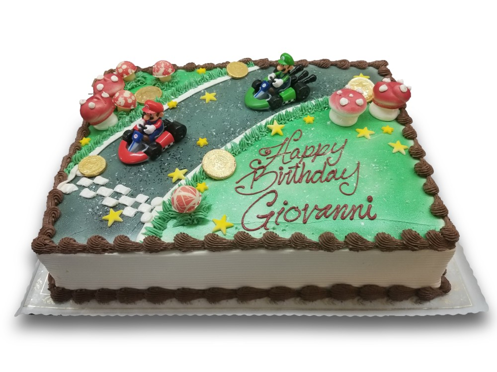 Mario kart birthday cake with chocolate coins and mushrooms and sugar stars 