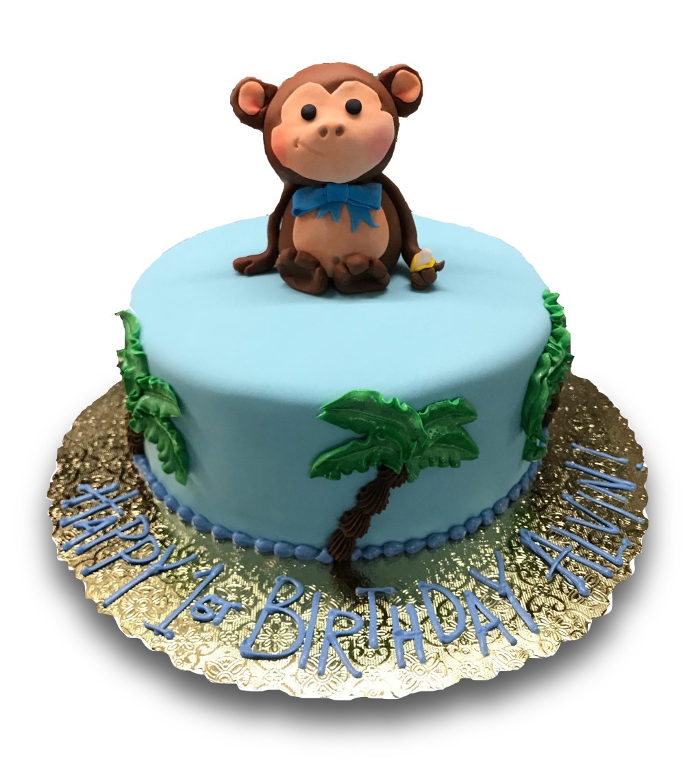 Cute fondant monkey on fondant covered cake