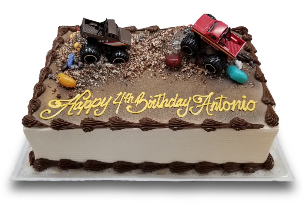 Monster truck themed birthday cake with cake crumbs and chocolate rocks 
