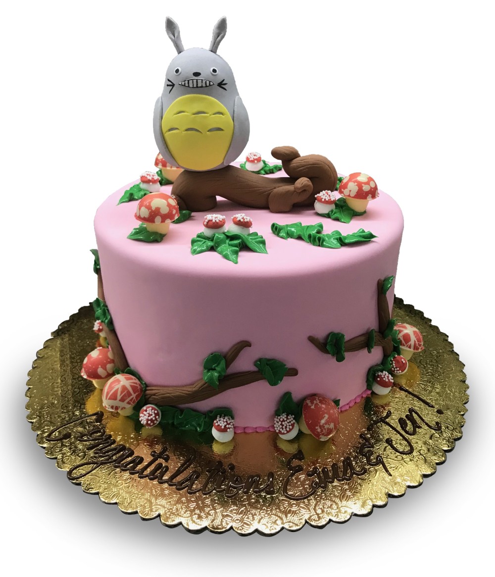 Fondant covered Totoro birthday cake with chocolate mushrooms and branches