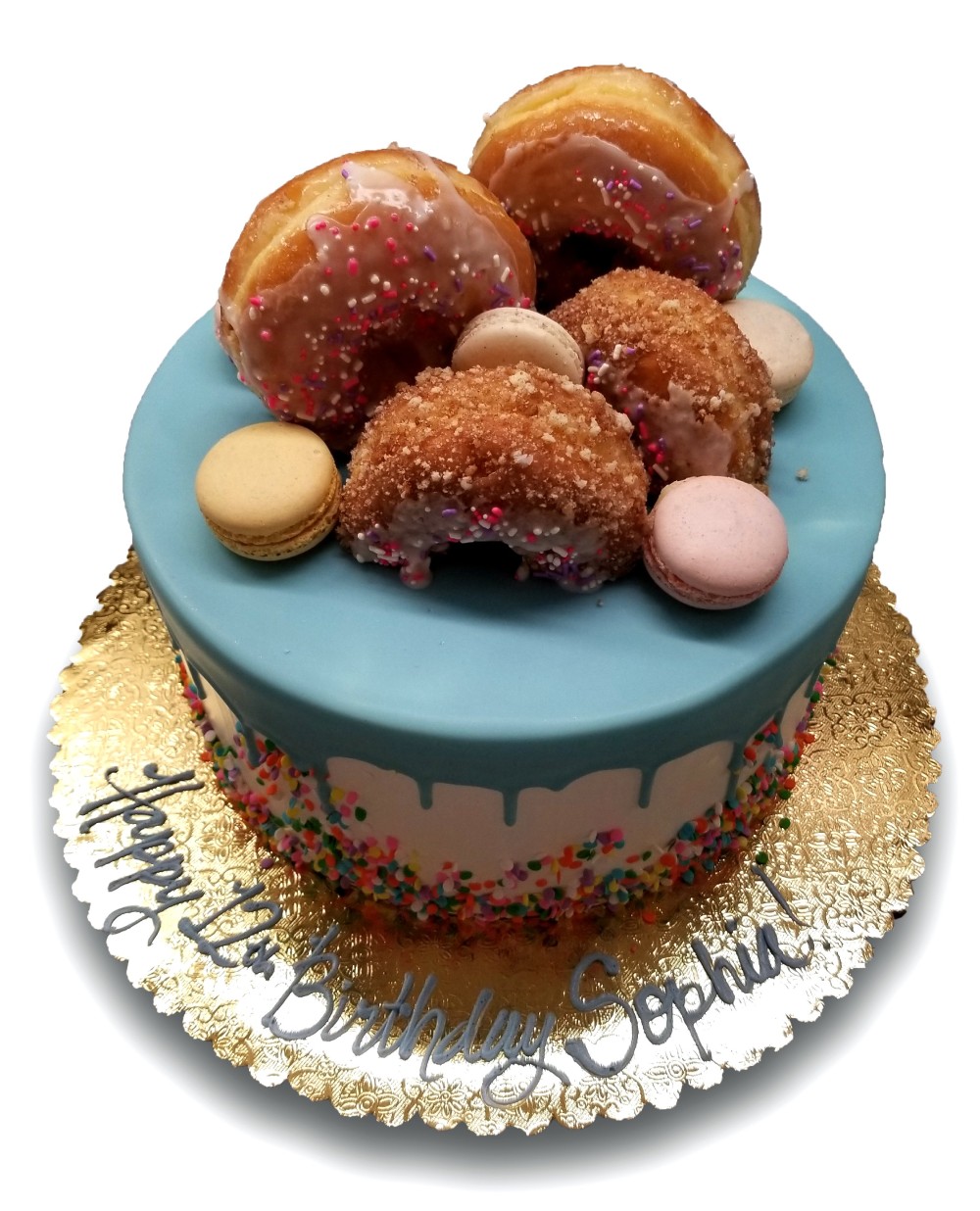 Donut and macaron cake with dripping blue chocolate and sprinkles