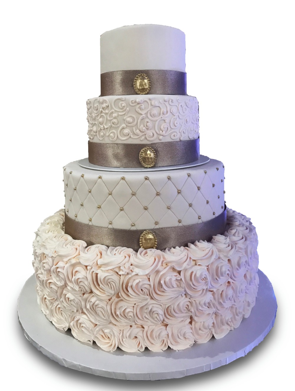 Four tier fondant covered wedding cake with ribbon and fondant broaches 