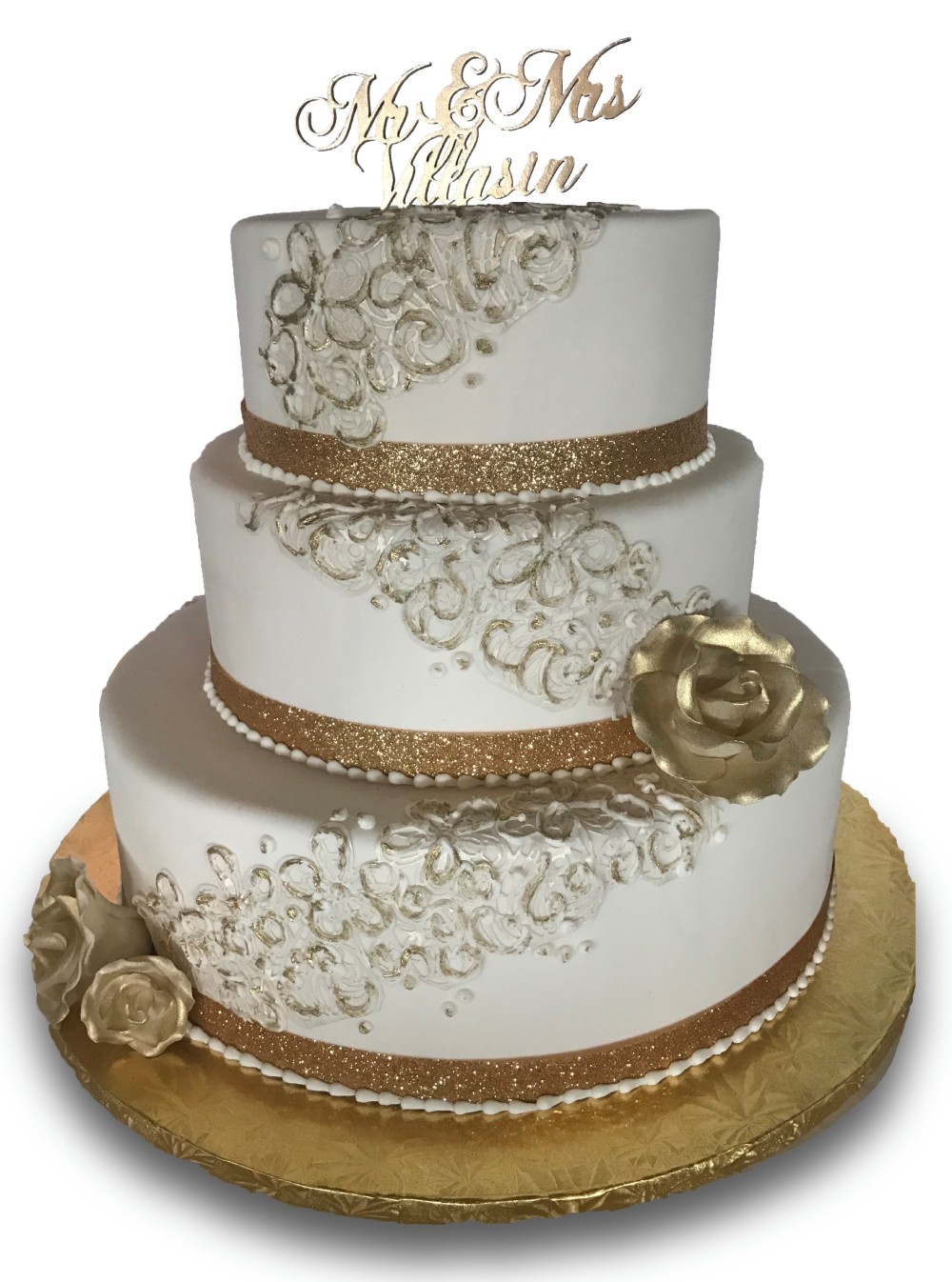 Three tier fondant covered wedding cake with buttercream lace and ribbon 