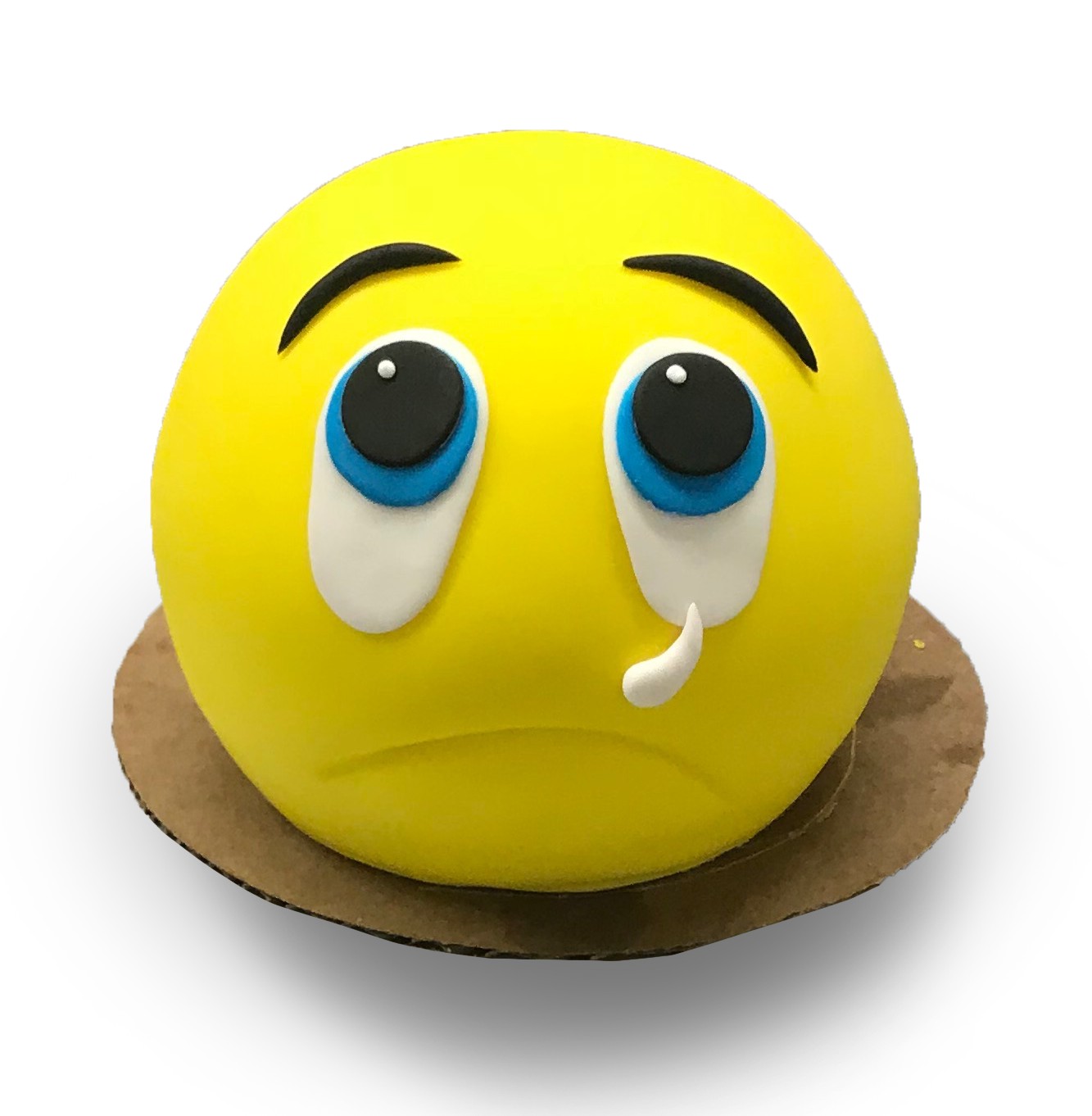 Fondant covered sad emoji cake