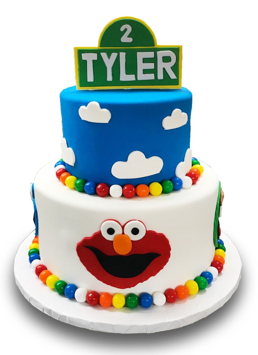 Tiered fondant covered cake with gumballs and gumpaste plaque